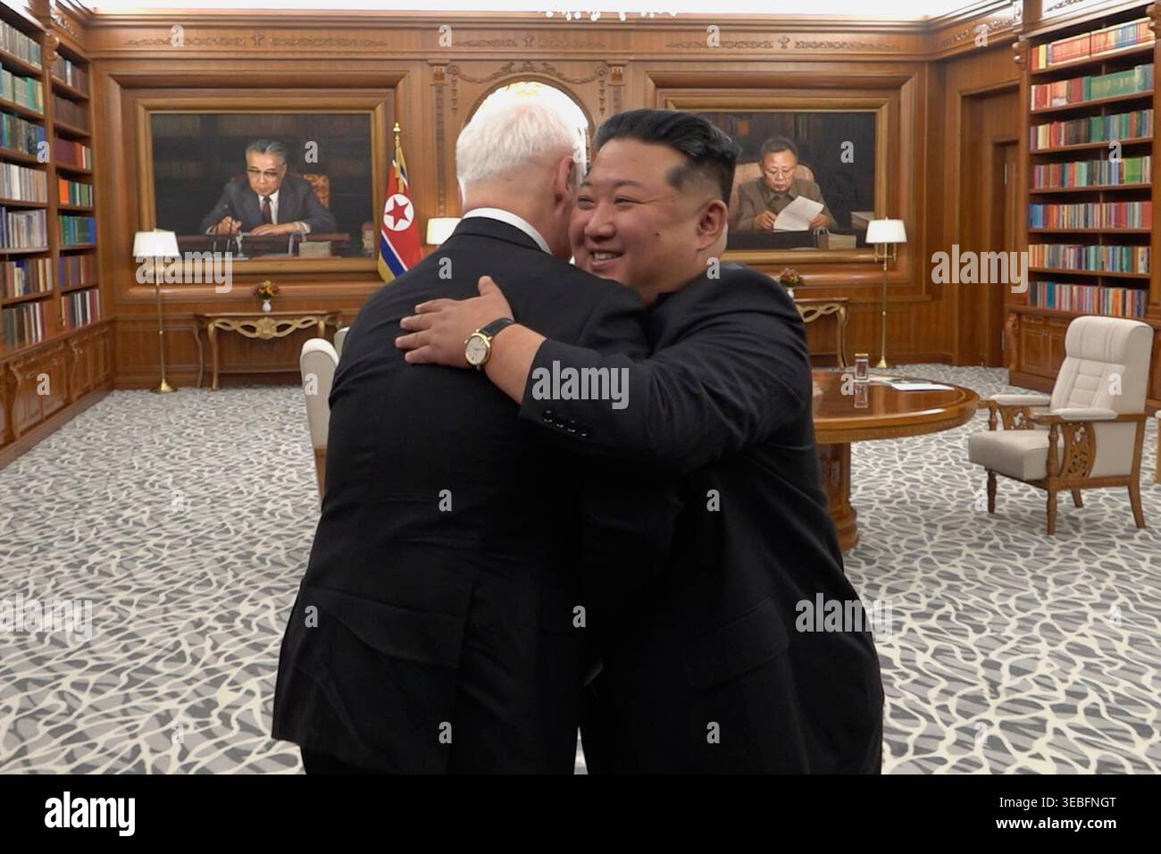In this image, made from video and provided by Russian Defense Ministry Press Service on Sunday, April 26, 2026, Russian Defense Minister Andrey Belousov, left, and the North Korean government, its leader Kim Jong Un, embrace each other during their meeting to discuss the current state and prospects of military cooperation between Moscow and in Pyongyang, North Korea. (Russian Defense Ministry Press Service via AP) Stock Photo