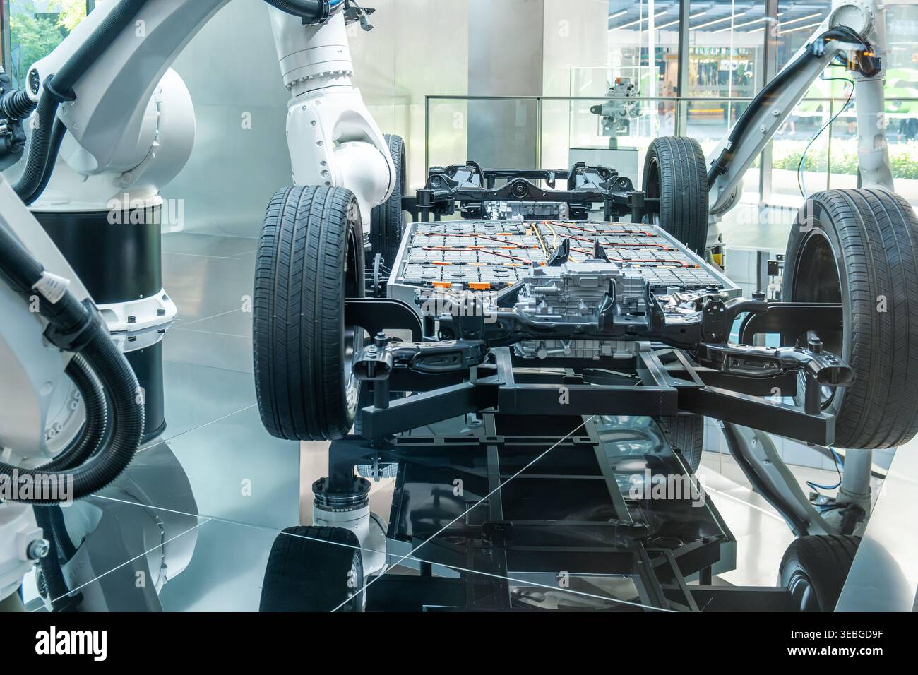 Electric vehicle chassis showing battery modules and suspension system ...