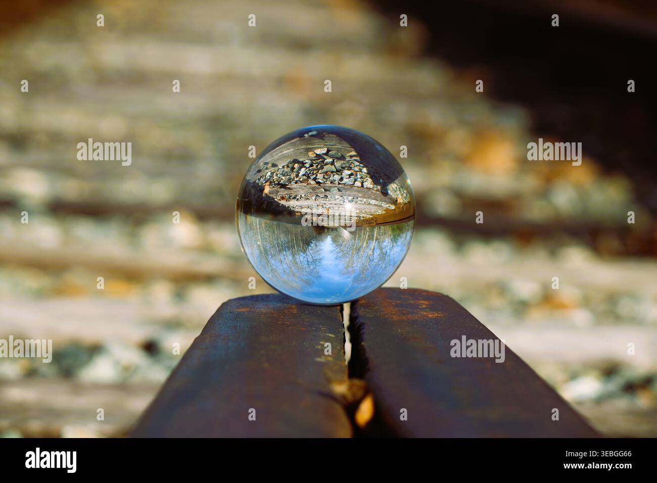 Glass Ball On Train Tracks Stock Photo