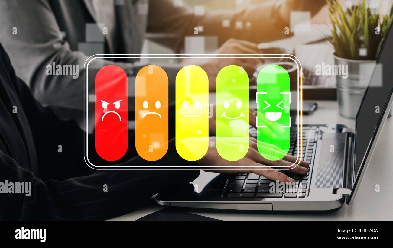 Emotion Indicator on Laptop Screen Showing Various Expressions with Colorful Battery Levels Representing Different Feelings in a Modern Office Setting Stock Photo
