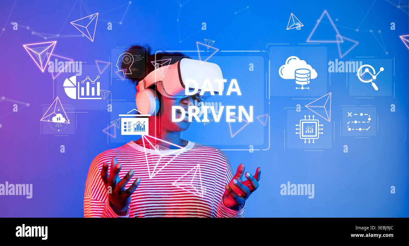 A user interacts with virtual reality technology while exploring data-driven insights and visualizations, highlighting the importance of analytics in Stock Photo