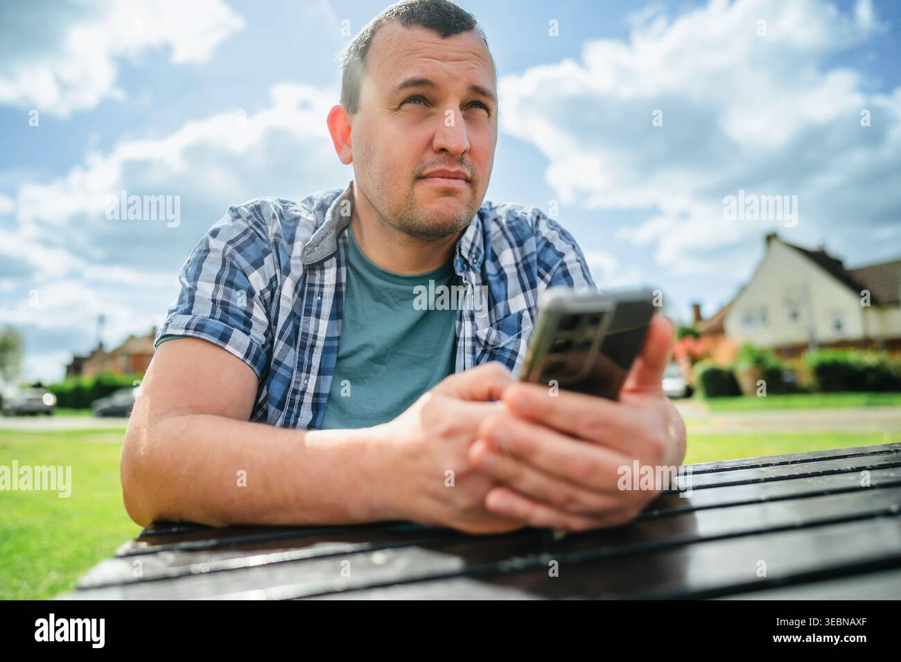 Man using smartphone, outdoors portrait Stock Photo