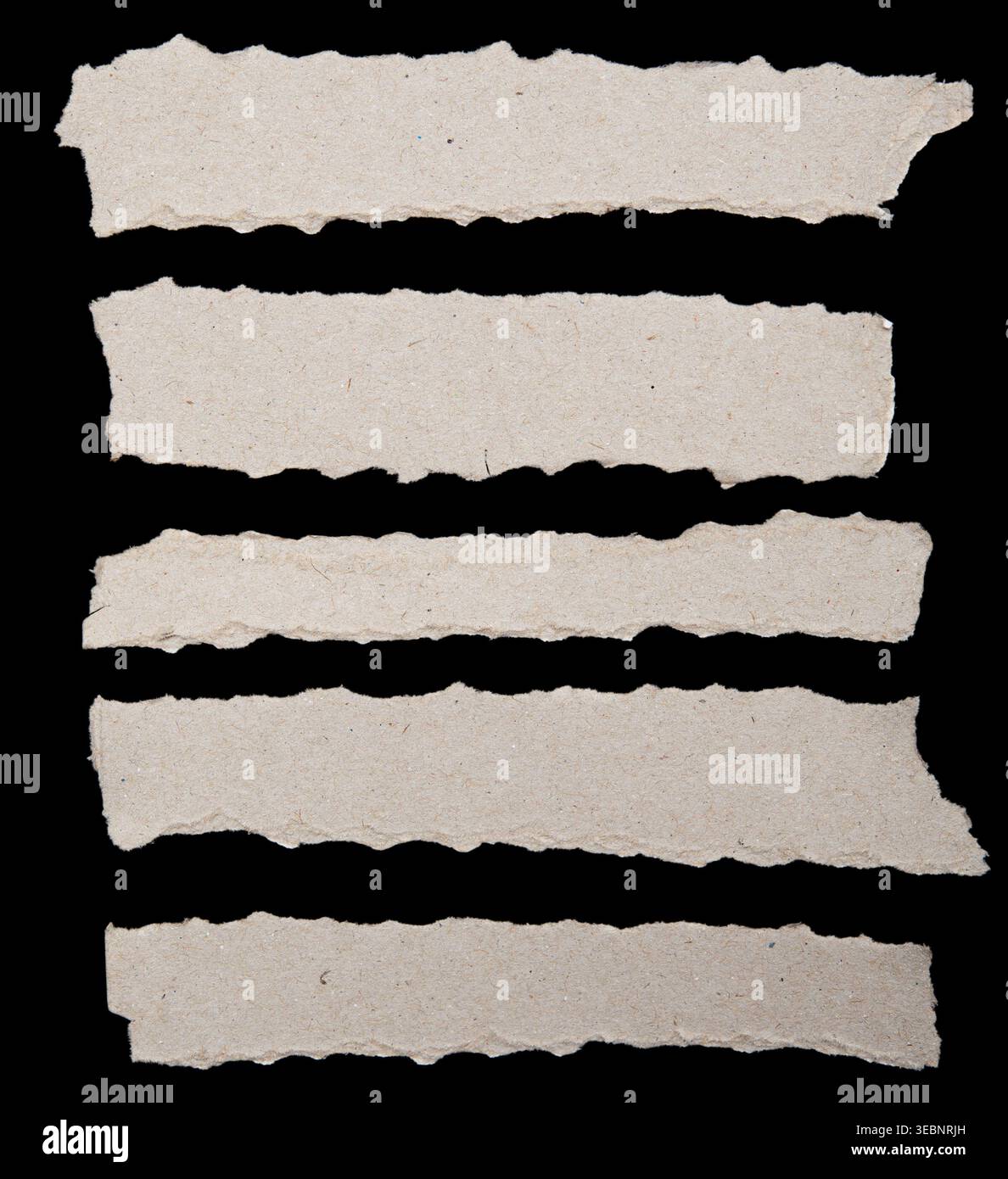 Ripped paper strips on black background Stock Photo