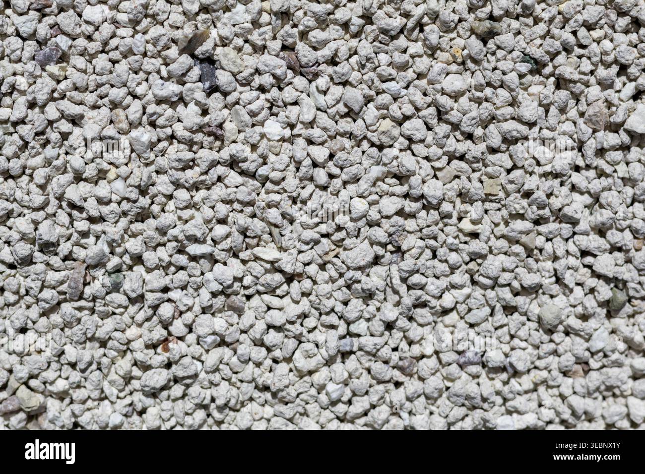 Close-up of white gravel texture with small irregular stones Stock Photo