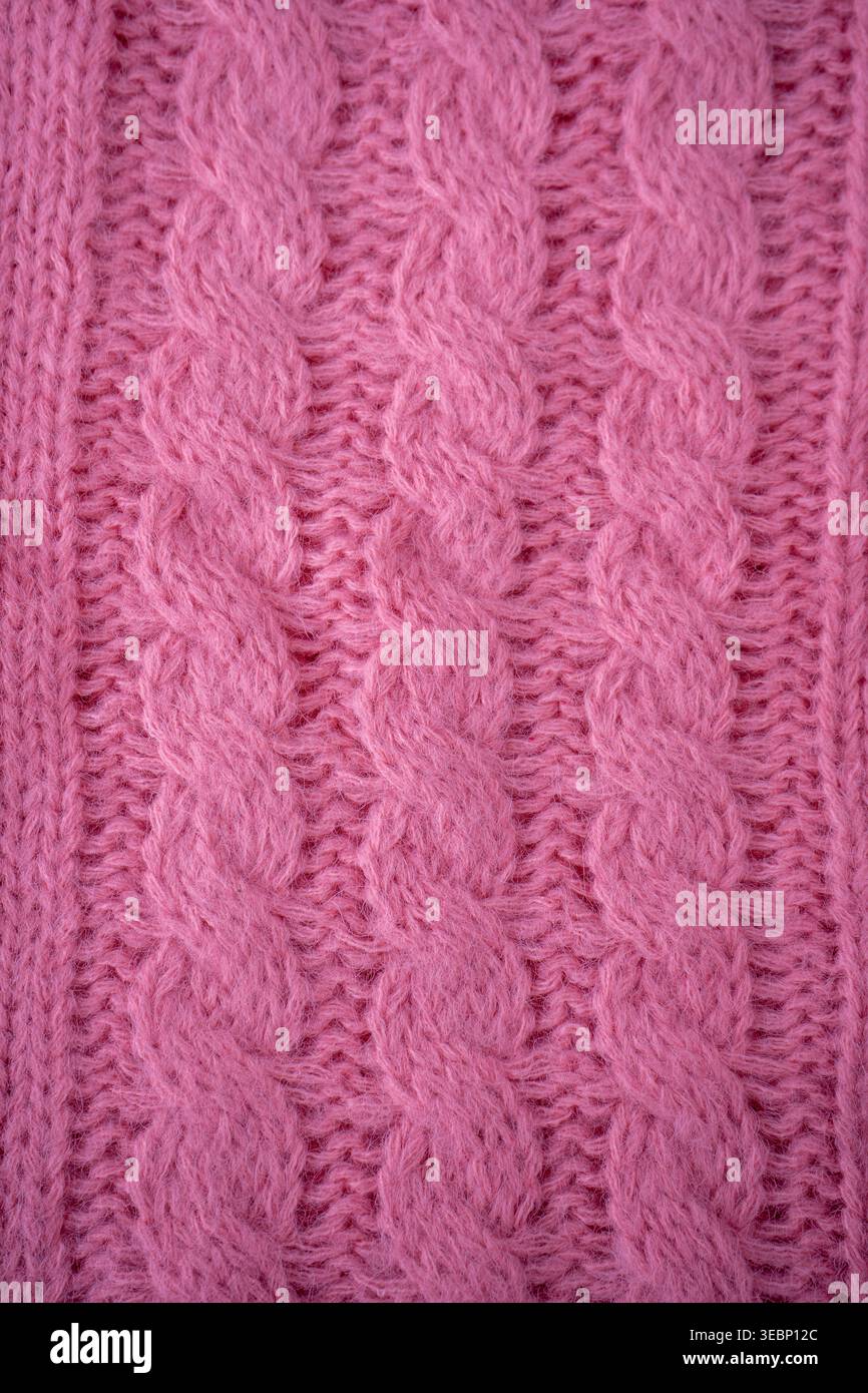 Pink cable Knit Fabric wool sweater background. Stock Photo