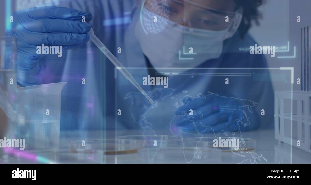 Tech Using Pipette Pipetting tech with PPE at lab bench using pipette placing droplet into ...