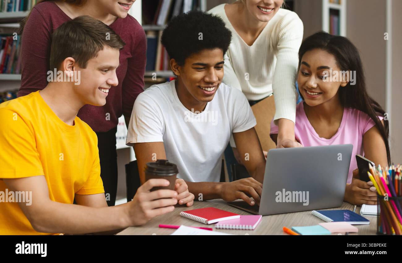 Group of Students Collaborating on a Project in a Modern Educational Setting Stock Photo