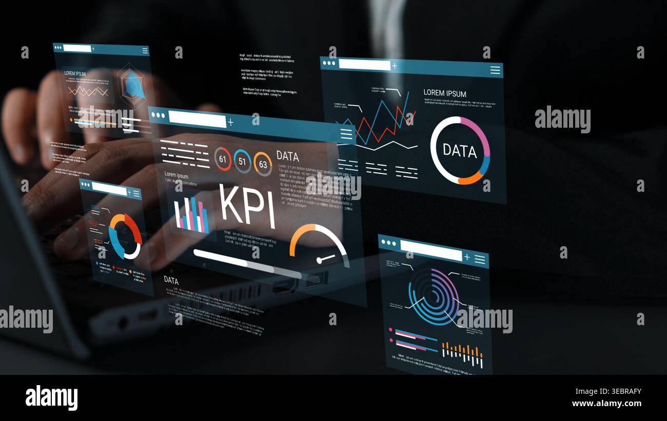 Hands typing on a laptop while interacting with digital data visualizations and KPI graphics, showcasing modern business analytics concepts and Stock Photo