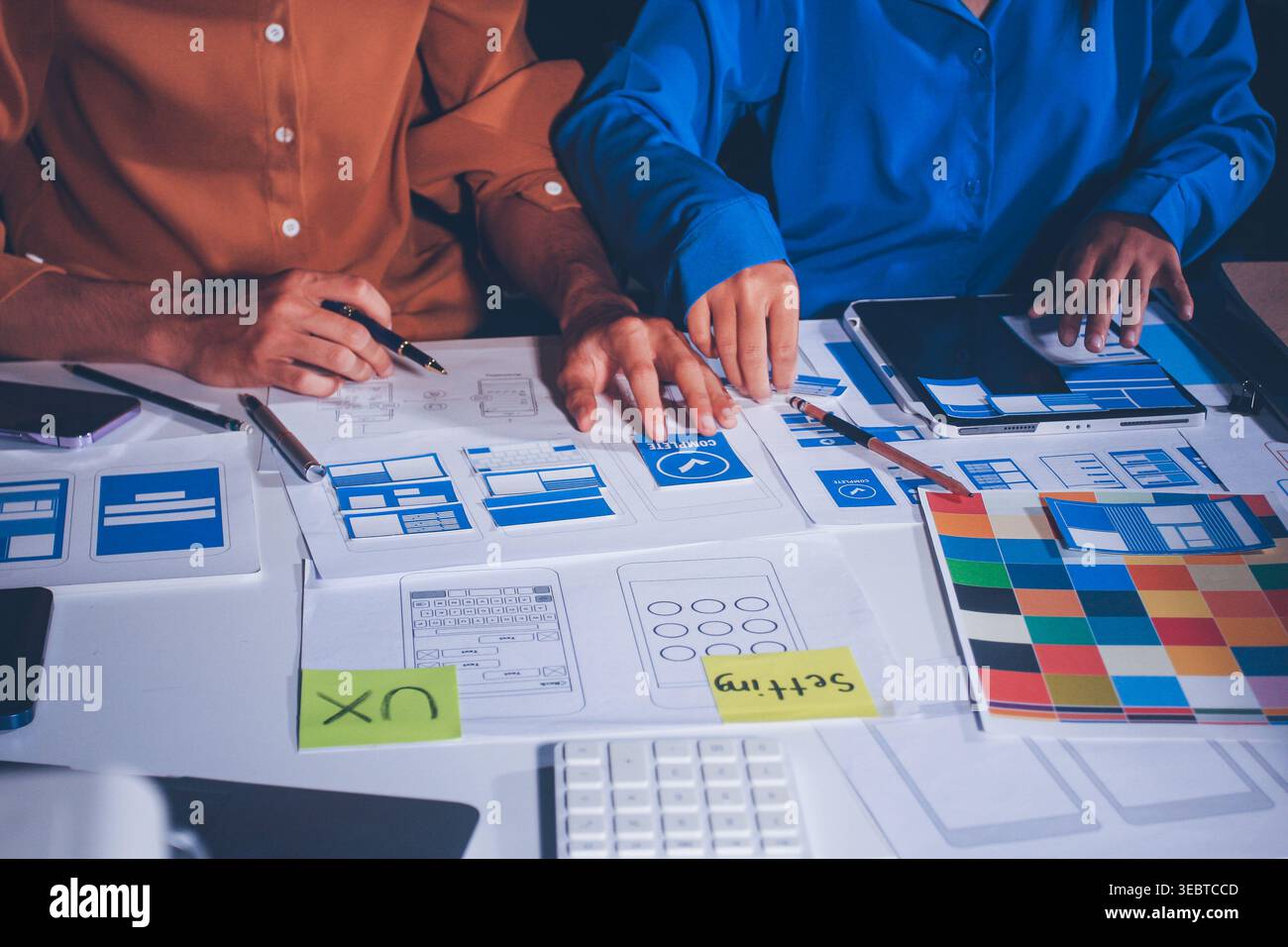 UXUI design brainstorming session with sketches and digital tools Stock Photo