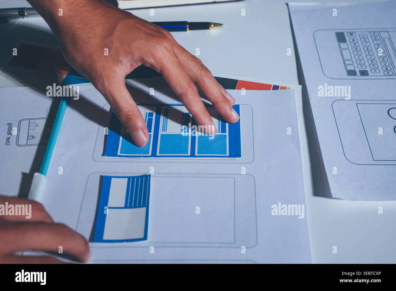 UXUI design brainstorming session with sketches and digital tools Stock Photo