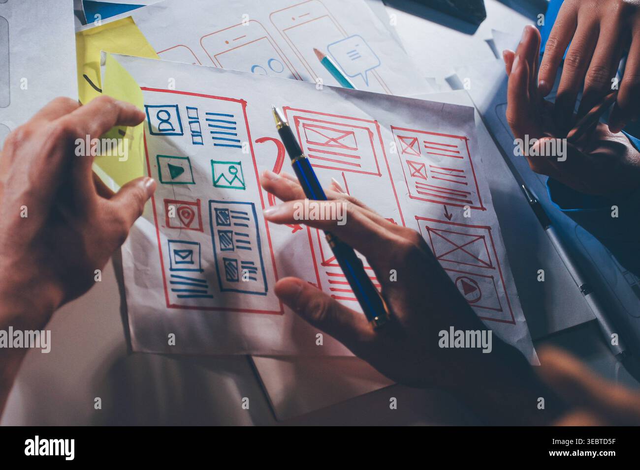 UXUI design brainstorming session with sketches and digital tools Stock Photo