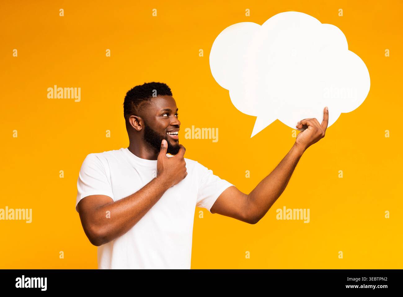 African-american man looking at blank speech bubble Stock Photo