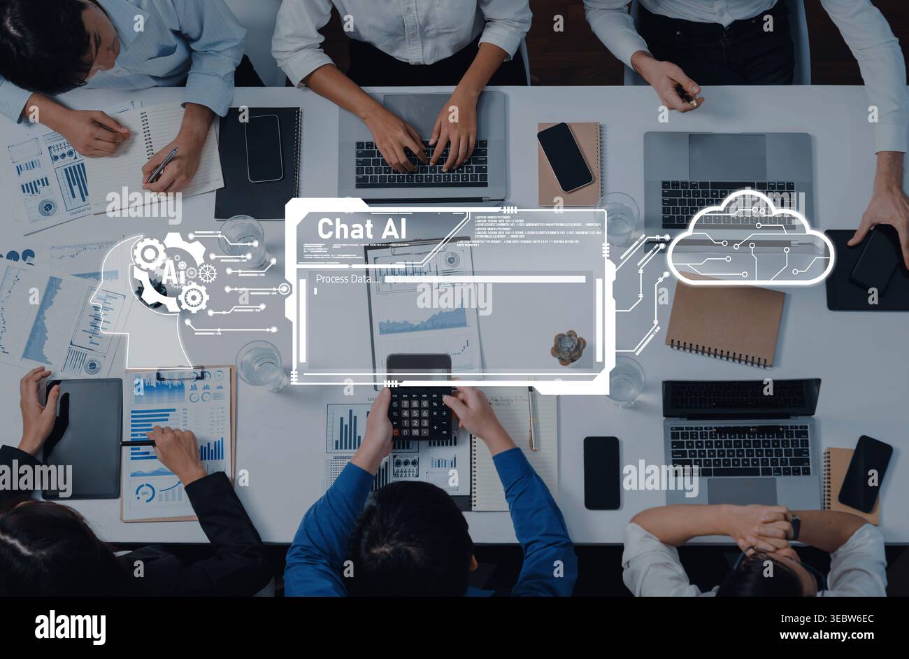 A dynamic meeting scene featuring professionals engaged in discussion, utilizing technology, with artificial intelligence and data visualization Stock Photo