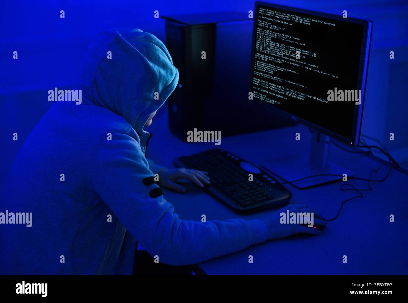 Cybercrime and Hacking Concept. Hacker Using Computer Virus Program Stock Photo