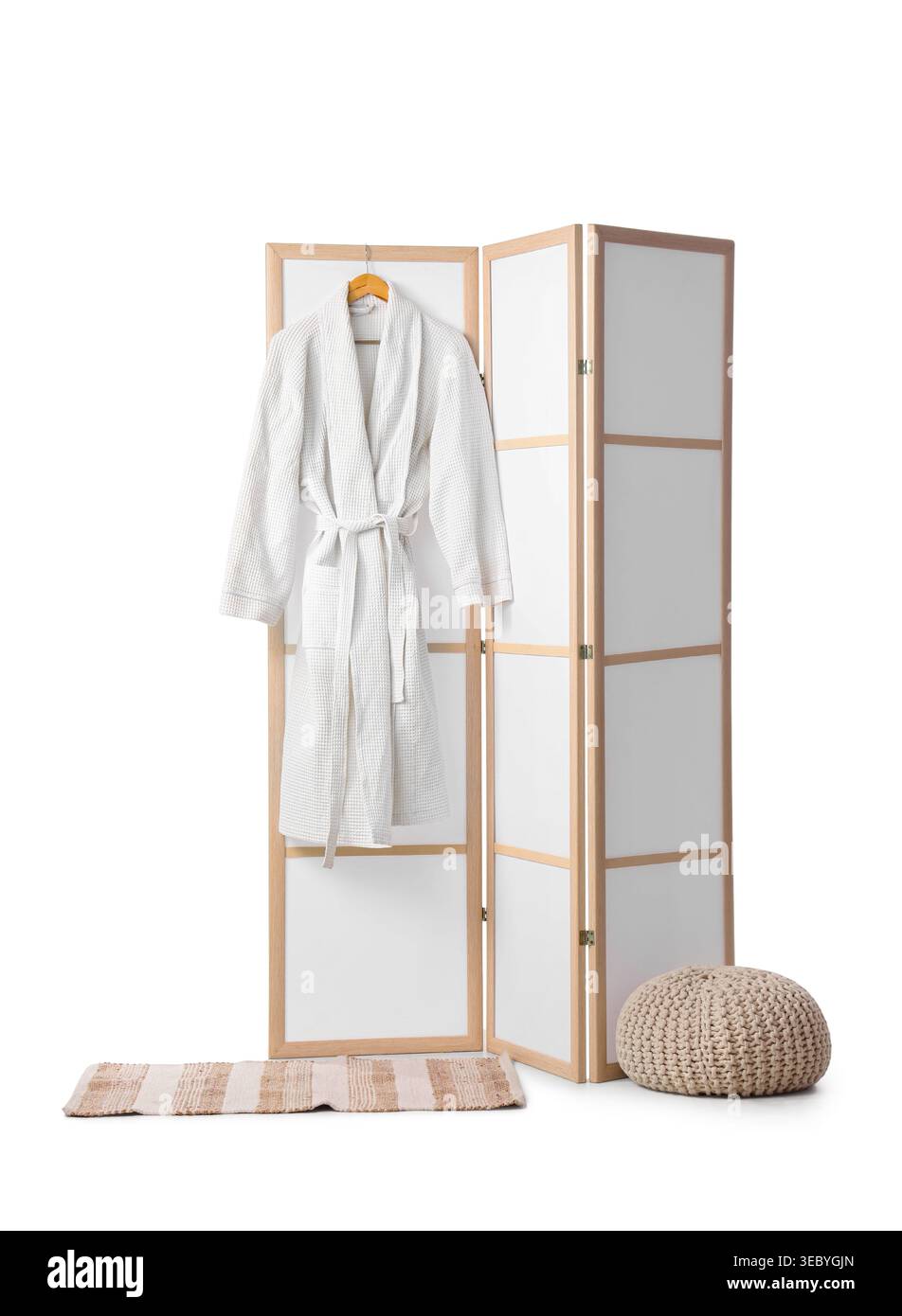 Modern folding screen with pouf and bathrobe isolated on white background Stock Photo