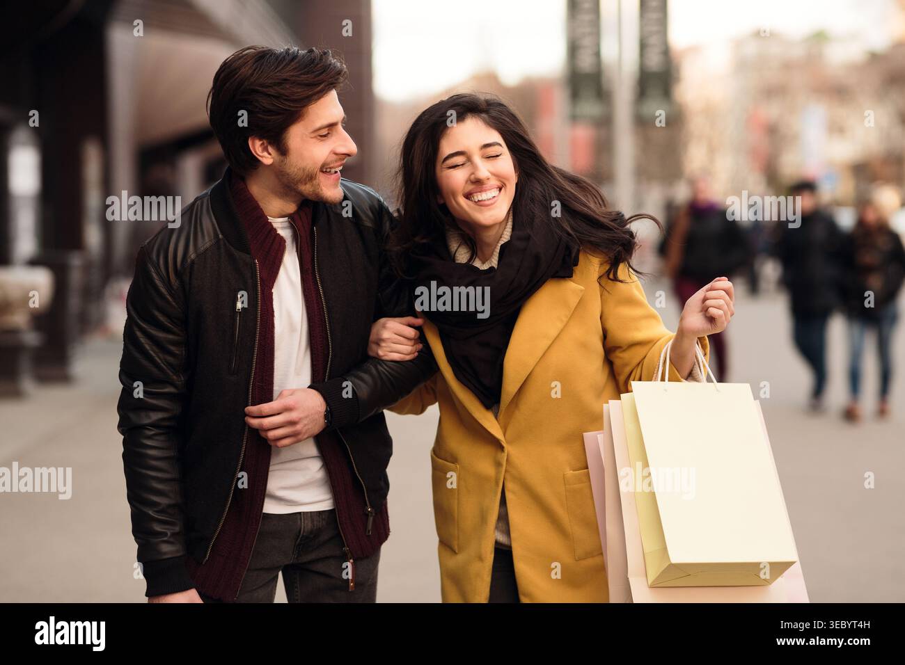 Excited couple doing shopping on weekend together Stock Photo