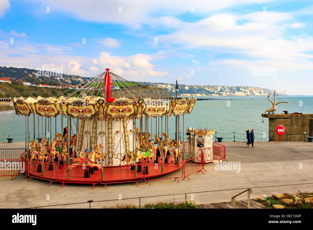 Gallopers Fairground Ride A fairground gallopers horse ride on the harbour arm at Folkestone ...
