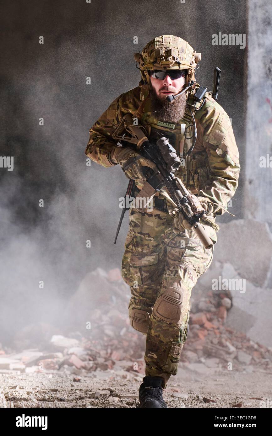 Armed Soldier In Tactical Gear Running Through Dusty Urban Ruins With ...