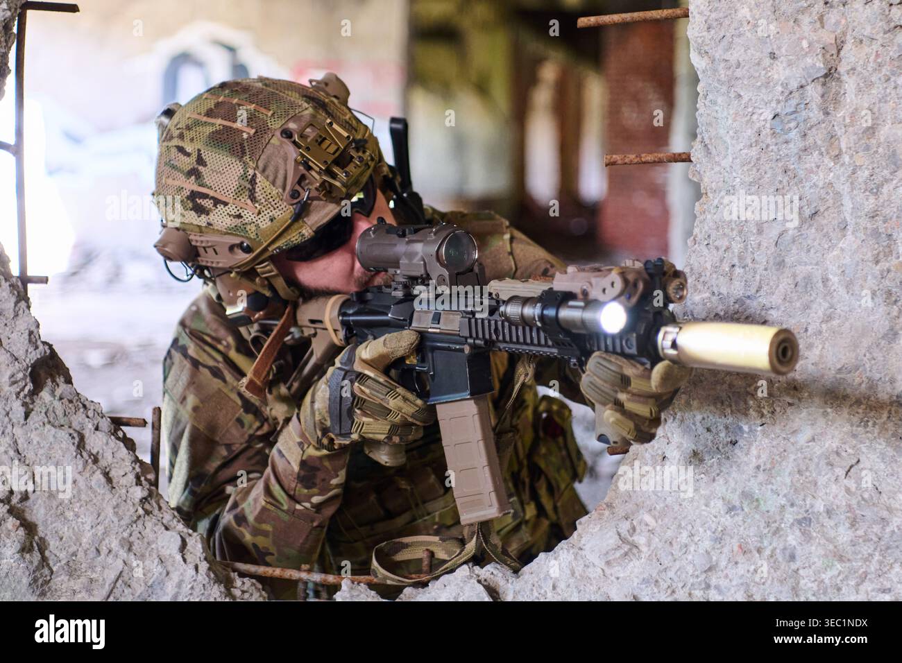 Camouflaged Soldier Aiming Tactical Rifle Through Broken Wall During ...