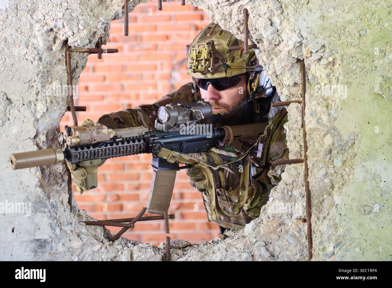 Tactical Soldier Aiming Assault Rifle Through Broken Concrete Wall ...