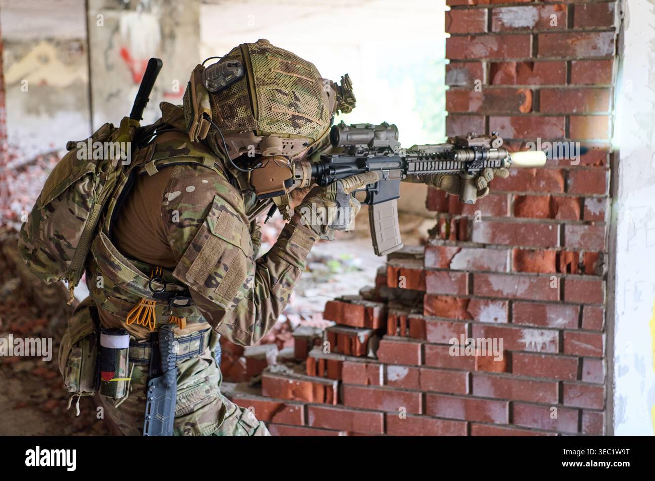 Camouflaged Soldier In Urban Combat Position Firing Assault Rifle ...