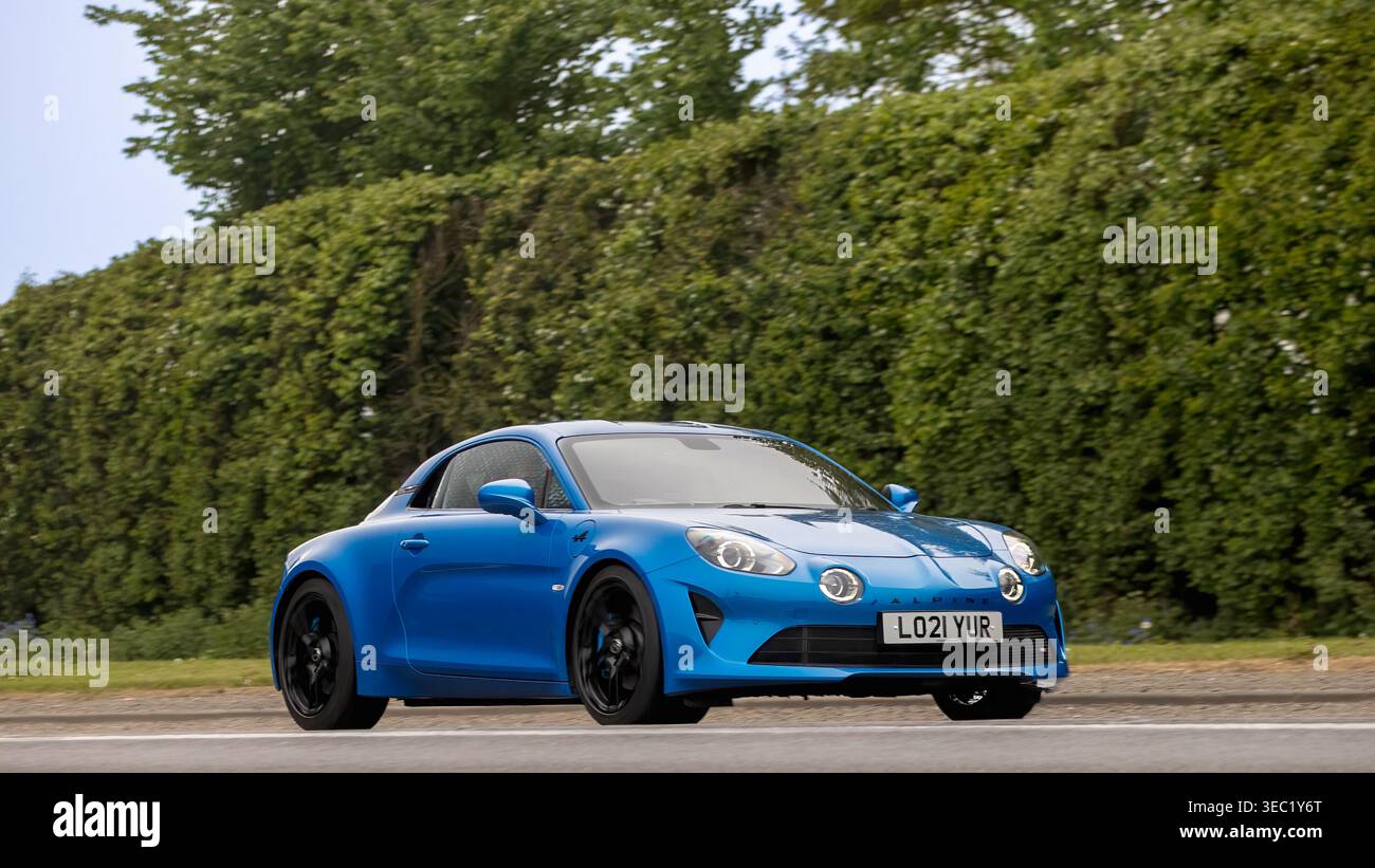 Bicester,Oxon.,UK - Apr 26th 2026:  2021 blue Alpine A110 Legende car driving on a British road Stock Photo