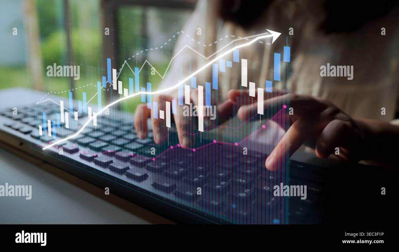 A business person engages with a laptop, utilizing data analysis tools and visual graphics to monitor financial trends and growth opportunities in a Stock Photo