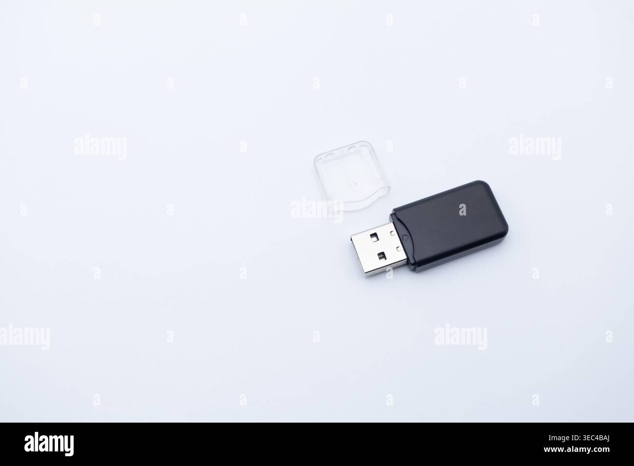 Black usb flash drive with transparent cap off, providing portable data storage on transparent background Stock Photo
