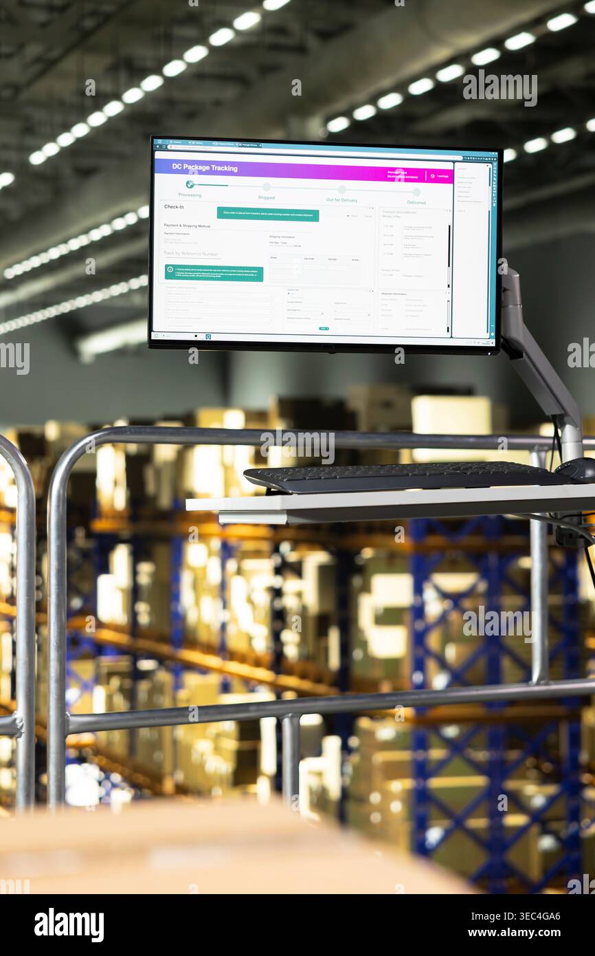 Empty logistics warehouse with computer monitor running tracking ...