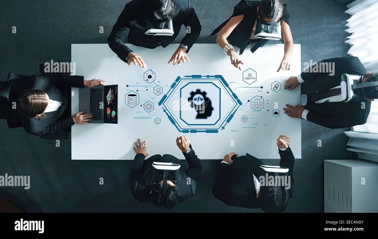 A business team uses virtual reality technology to collaborate in a modern office, analyzing data and discussing strategies for innovation and growth Stock Photo