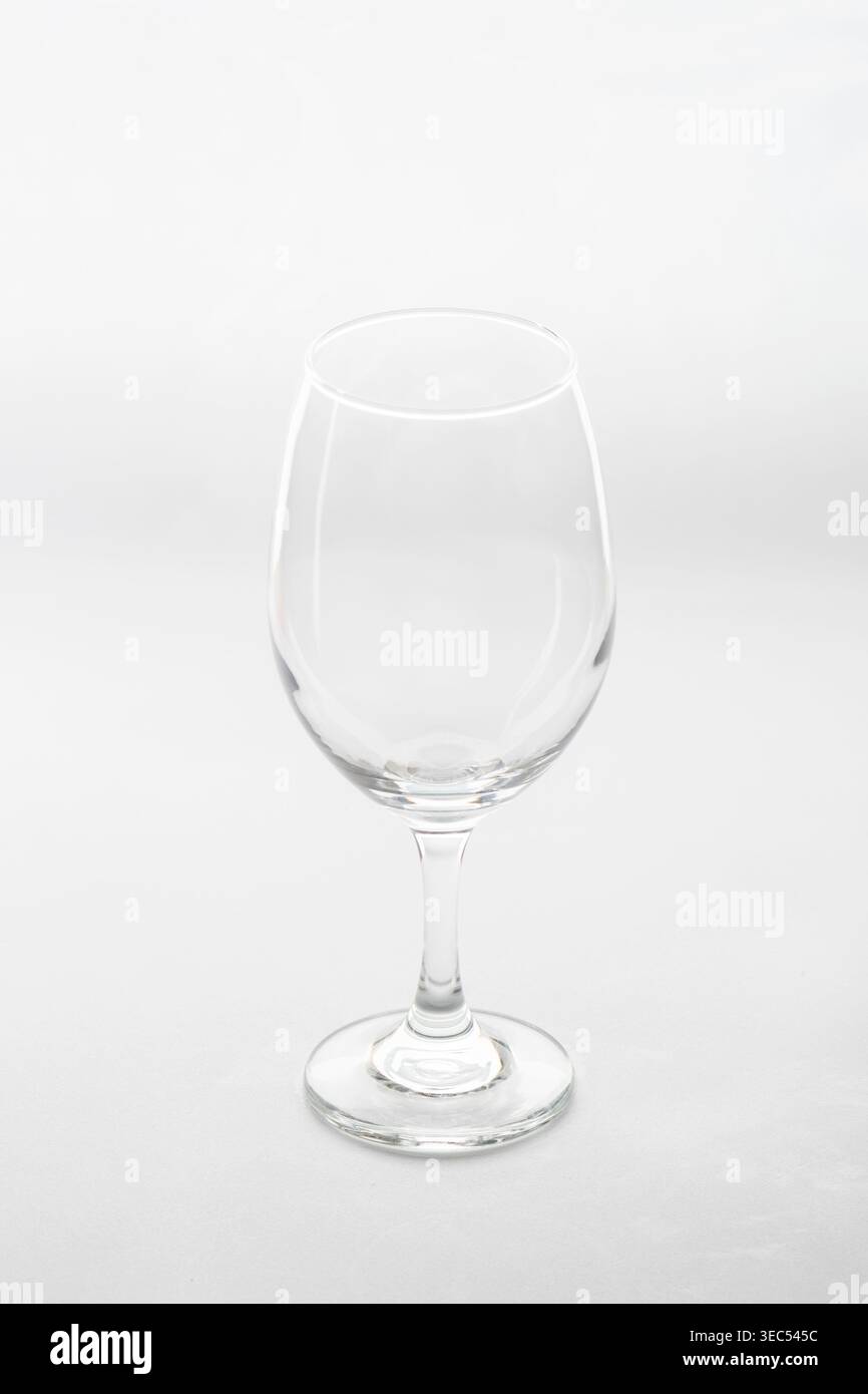 An empty wine glass, isolated against a white background Stock Photo