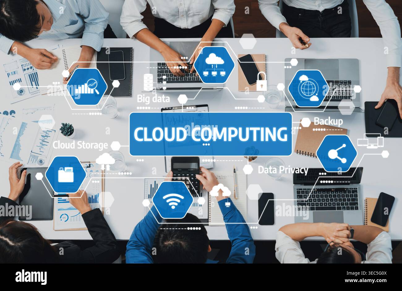 A diverse team collaborates using cloud computing concepts, focusing on data storage, privacy, and backup solutions in a modern office environment Stock Photo