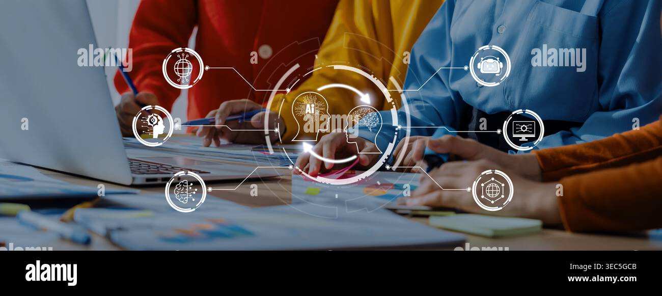 Dynamic team collaborating on innovative strategies using technology. Diverse hands engage with laptops and digital icons, enhancing productivity in a Stock Photo