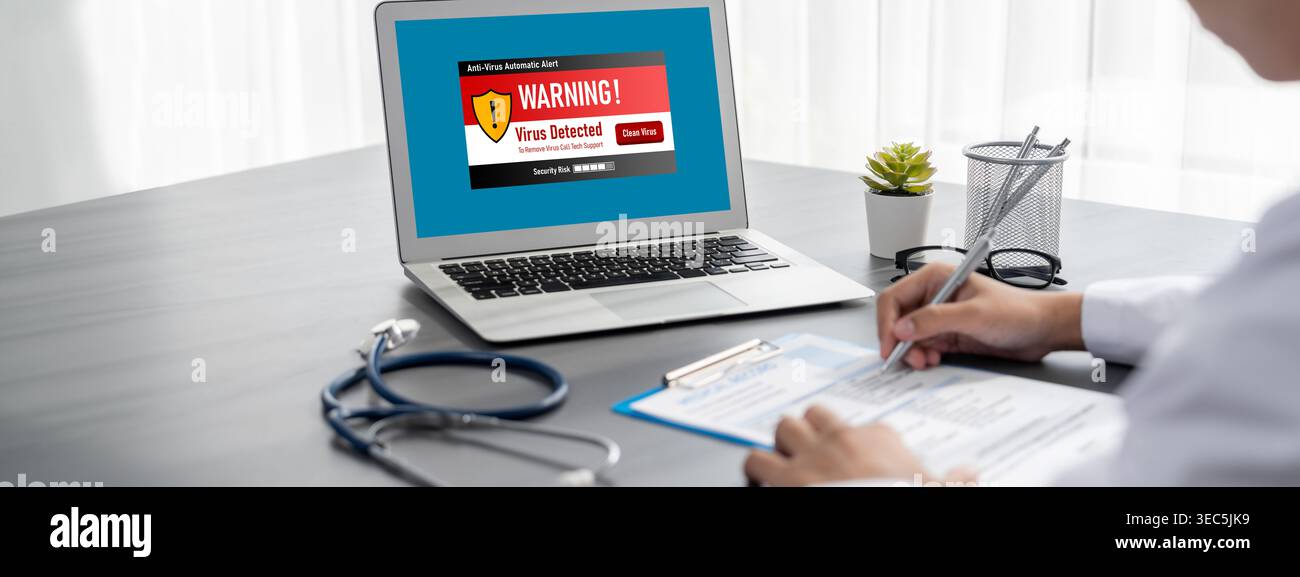 Virus warning alert on computer screen detected brisk cyber threat , hacker, computer virus and malware Stock Photo