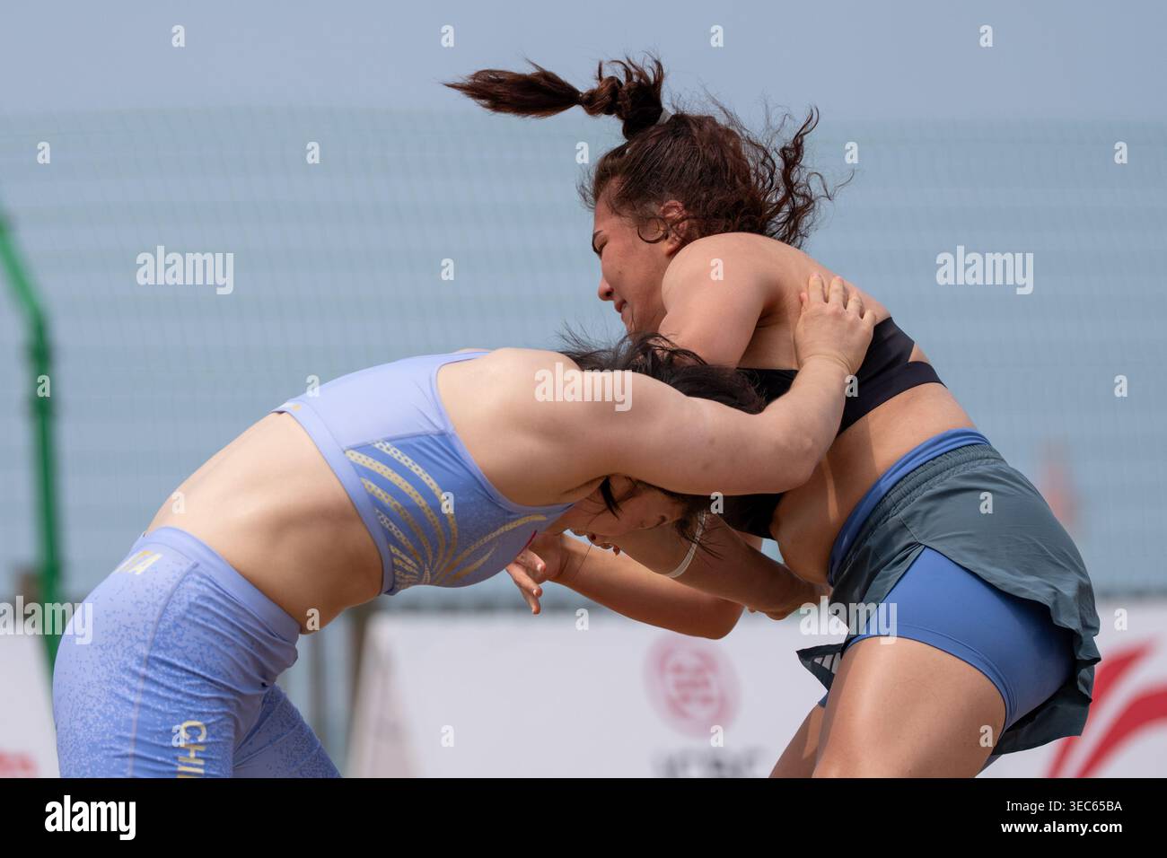 Sanya, China's Hainan Province. 29th Apr, 2026. Li Wenji (L) of China ...