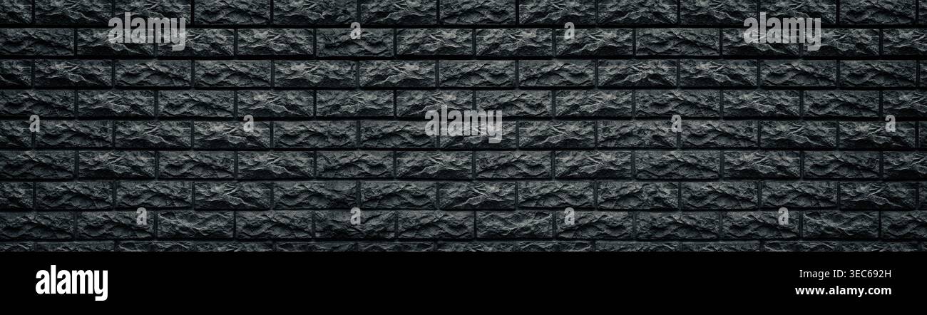 Wide dark gray stone blocks masonry background. Panoramic black brick wall texture Stock Photo