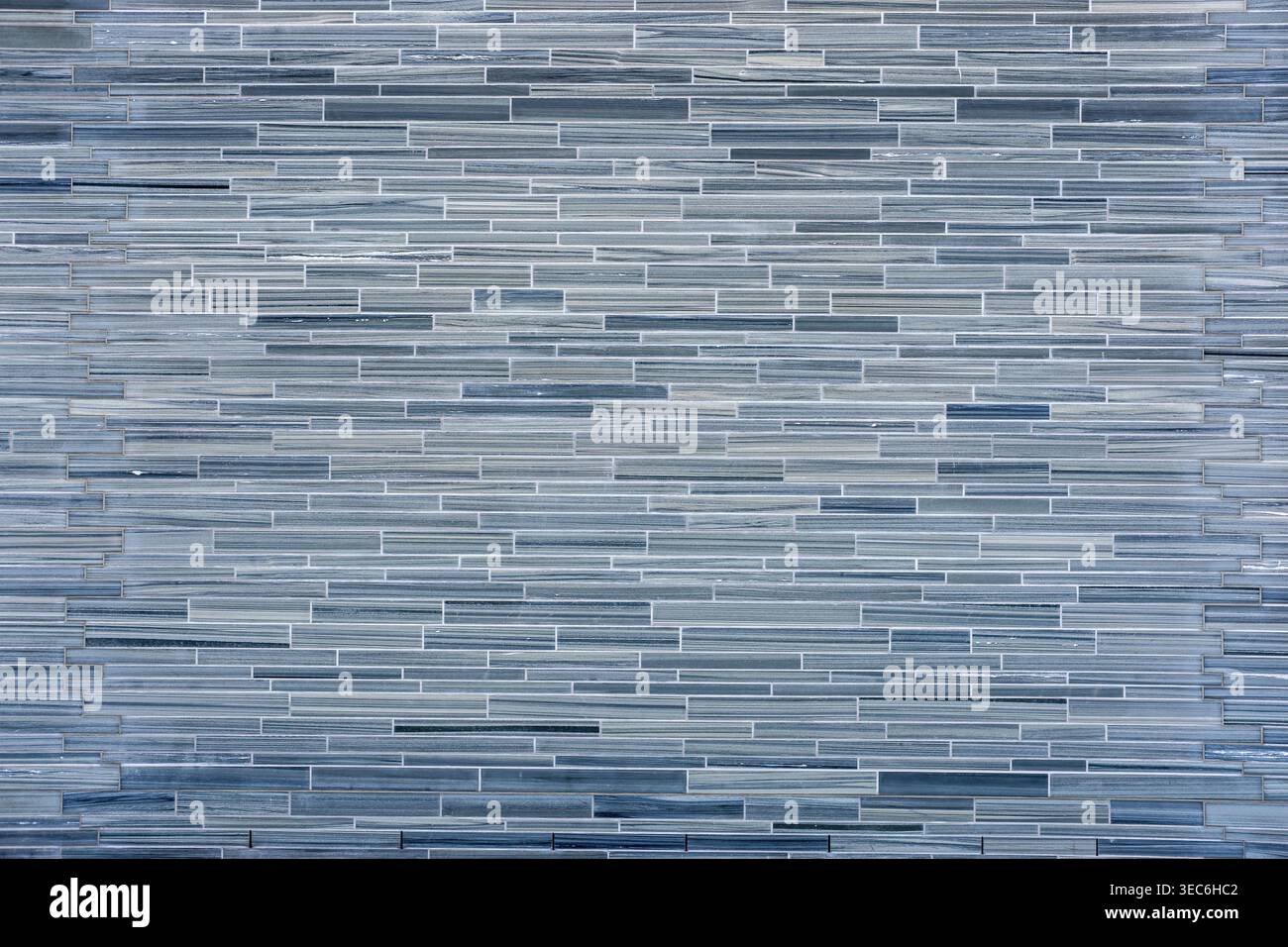 Background from a wall made of small gray stone tiles Stock Photo - Alamy