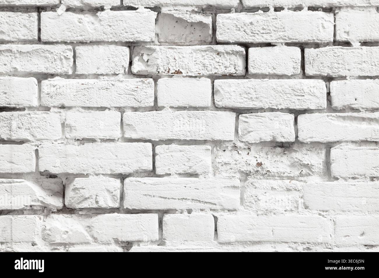 White painted old brick wall texture. Bleached rough aged brickwork. Niveous light background Stock Photo