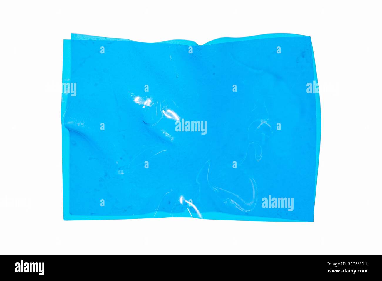 Blue plastic sheet with creases and transparent reflections, creased blank page on a white background, creating an abstract texture Stock Photo