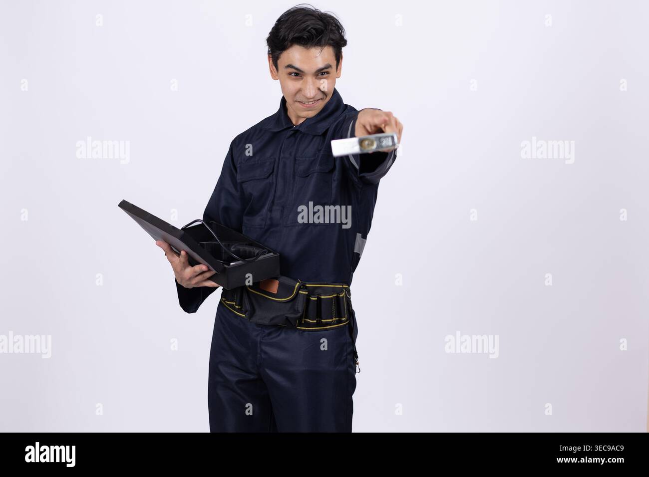 Professional security guard showing identification card in studio Stock Photo