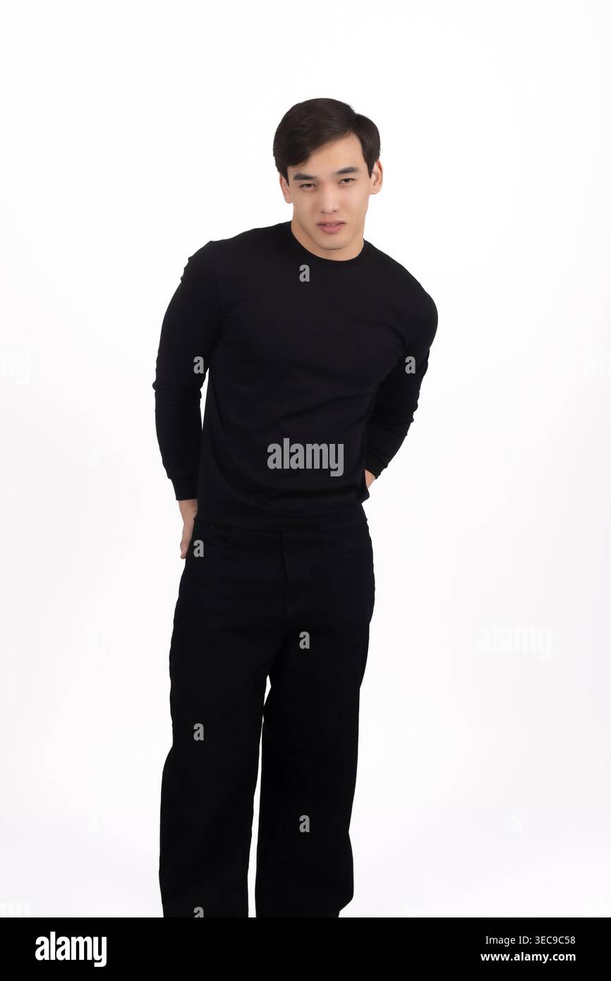 Man in black clothes looking thoughtfully at camera Stock Photo