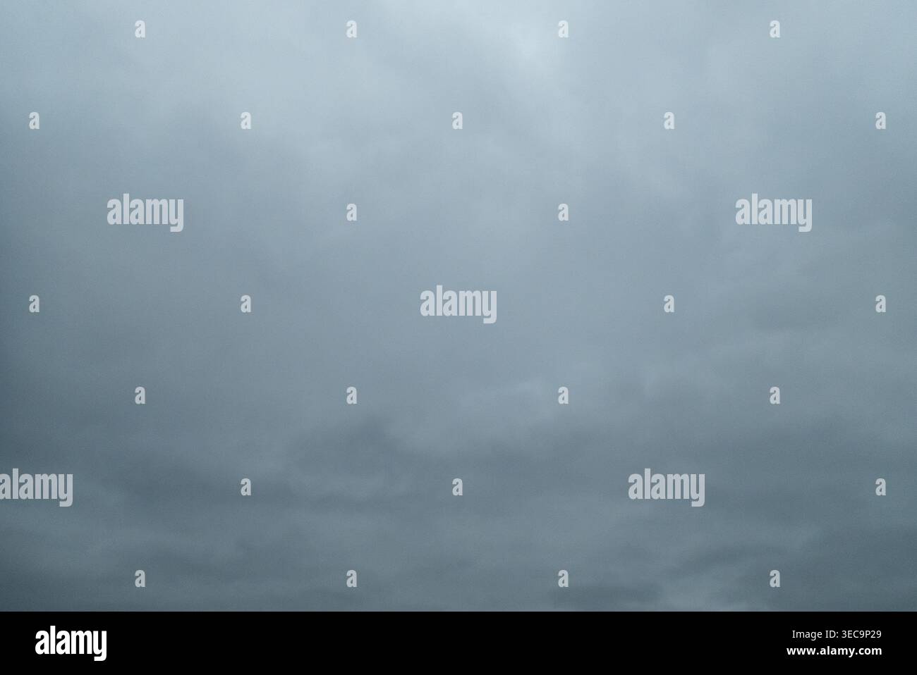 Dark grey storm clouds gathering in the sky Stock Photo