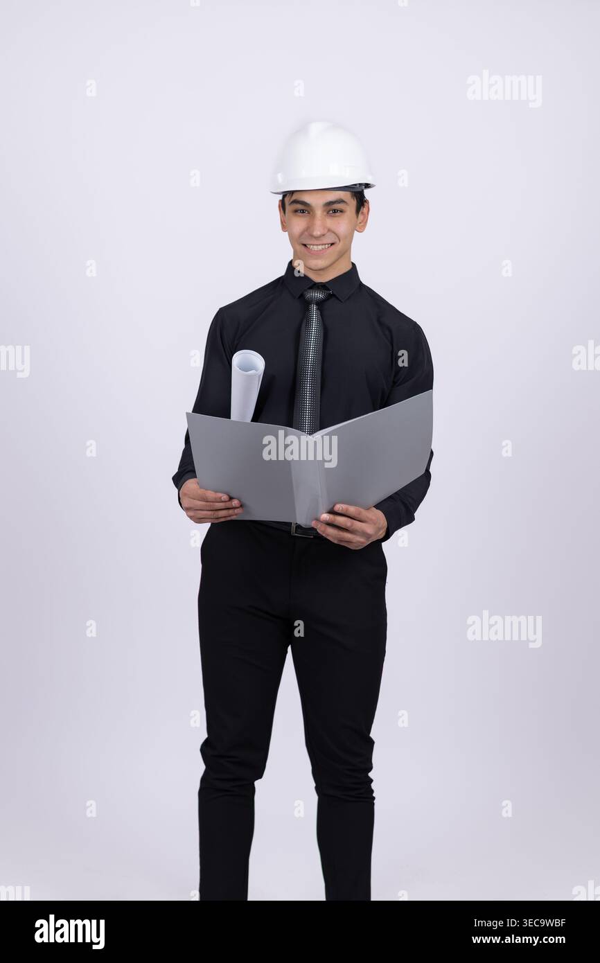 Engineer in hard hat holding digital tablet Stock Photo