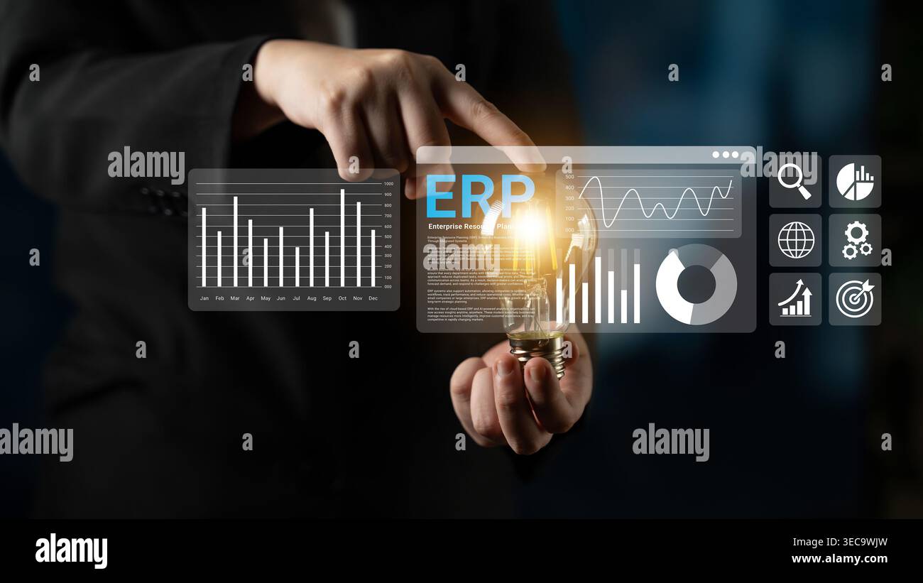 Business professional interacts with digital interface showing ERP software analytics and data visualization concepts with a glowing light bulb repres Stock Photo
