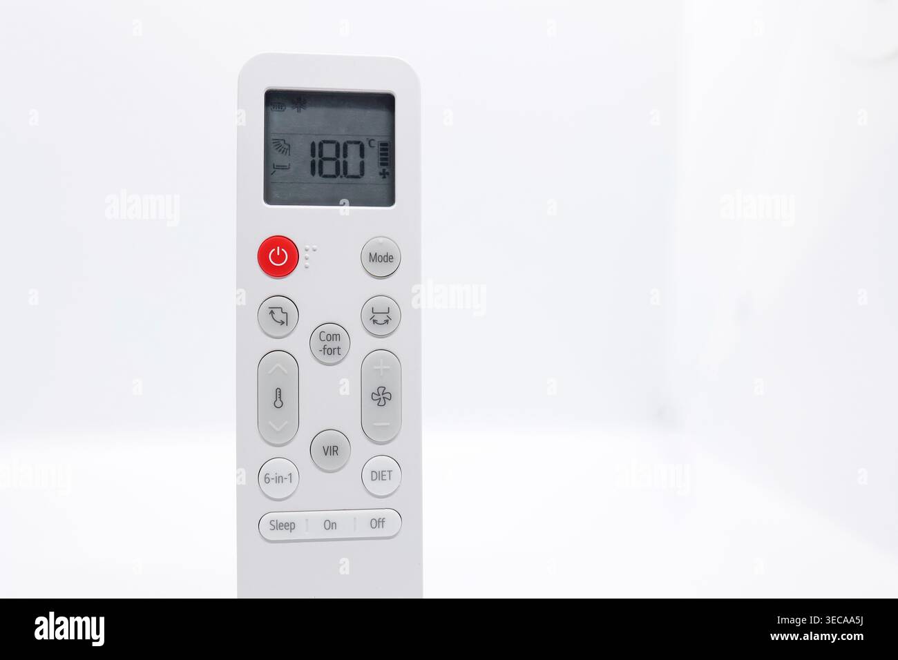 Air Conditioner Remote Control Set to 18°C on White Background with Copy Space, Summer Cooling Concept Stock Photo