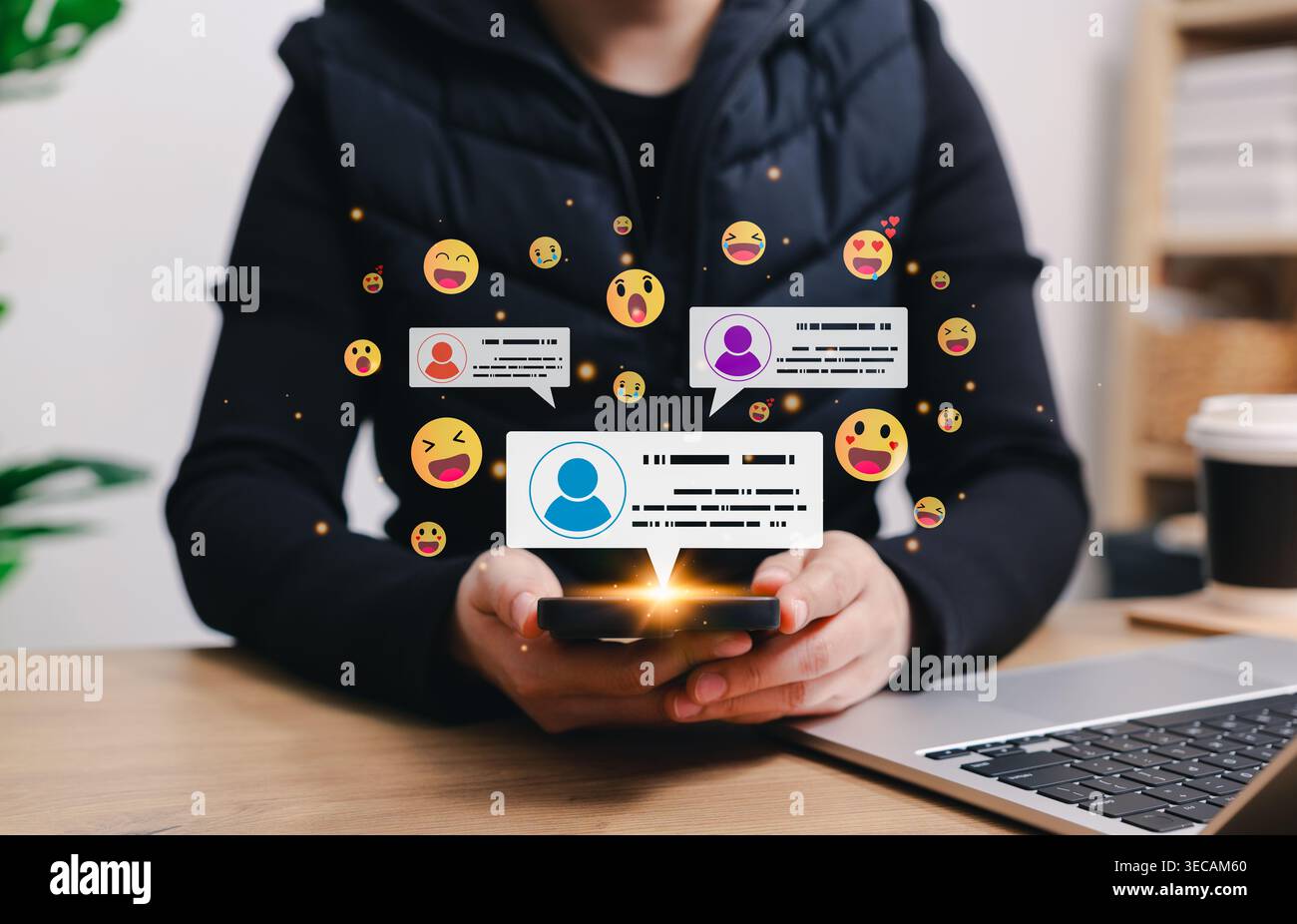 Social media marketing concept. Person holding smartphone with floating emoji icons and chat notification bubbles, representing online communication, Stock Photo