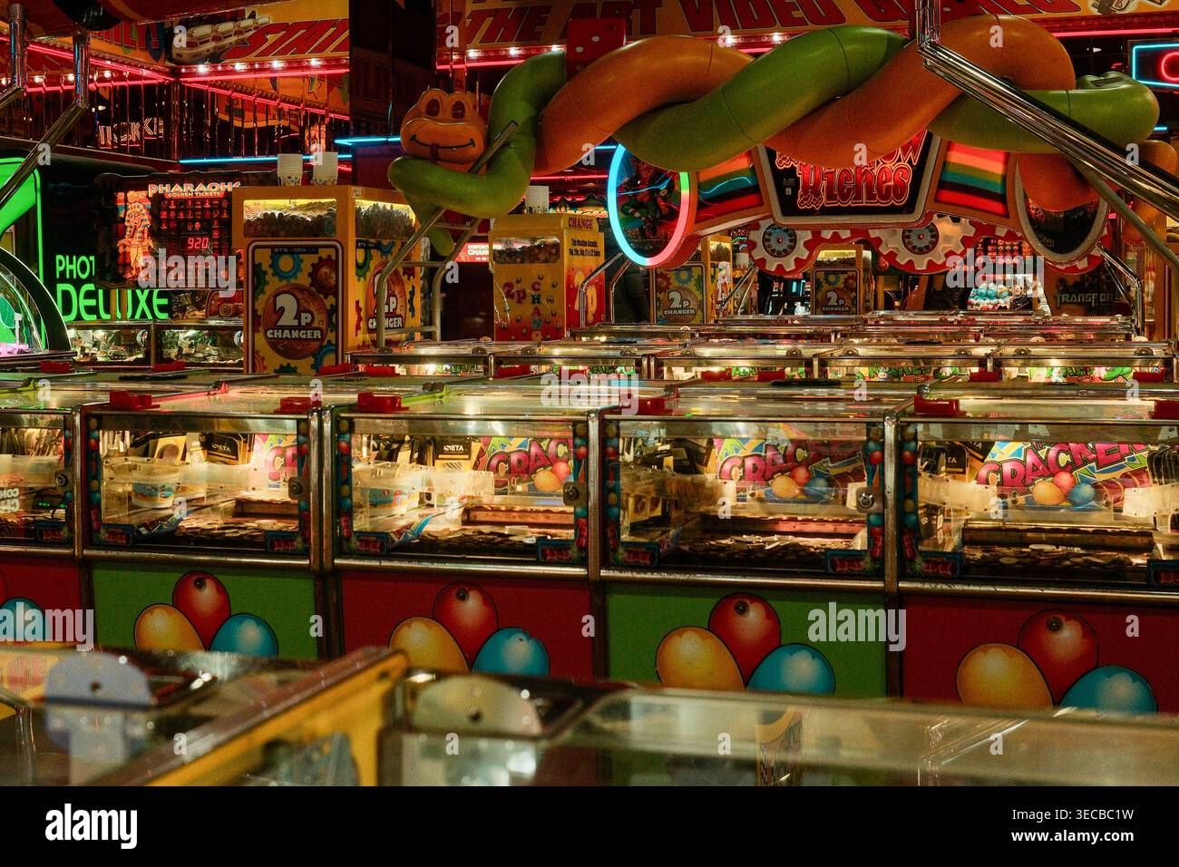 Interior of traditional British seaside amusement arcade with coin ...
