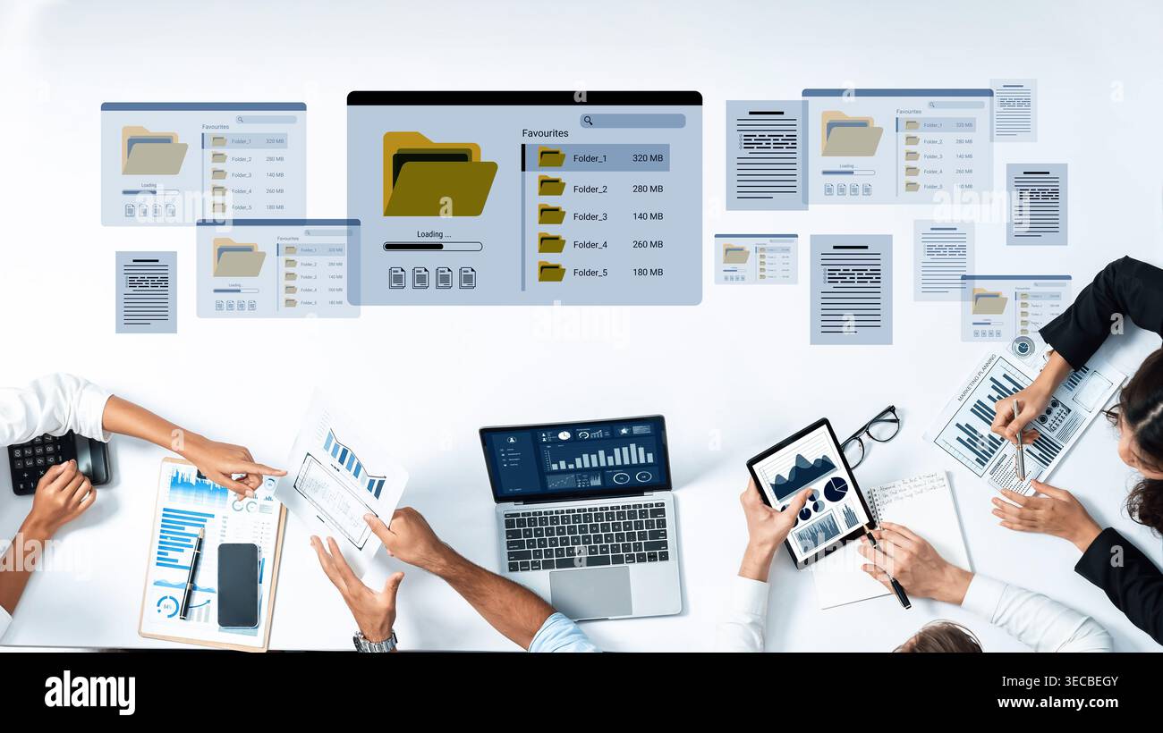 A modern business workspace featuring digital devices, data analysis tools, and collaborative teamwork. The environment emphasizes productivity and ef Stock Photo