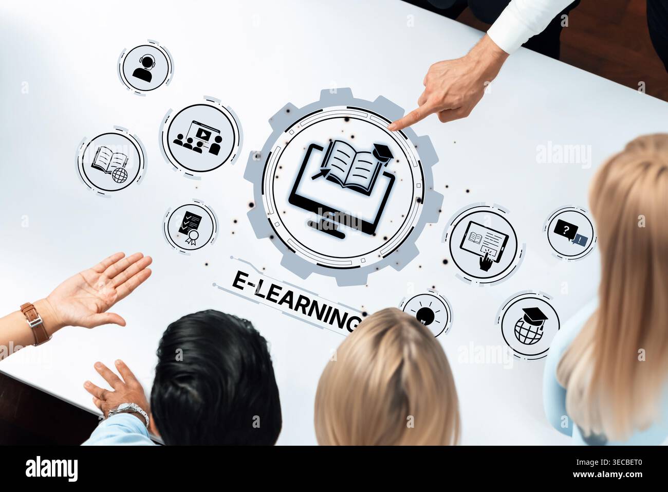 A group of diverse individuals gathers around a table, engaging in collaborative discussions on e-learning, utilizing interactive technology for educa Stock Photo