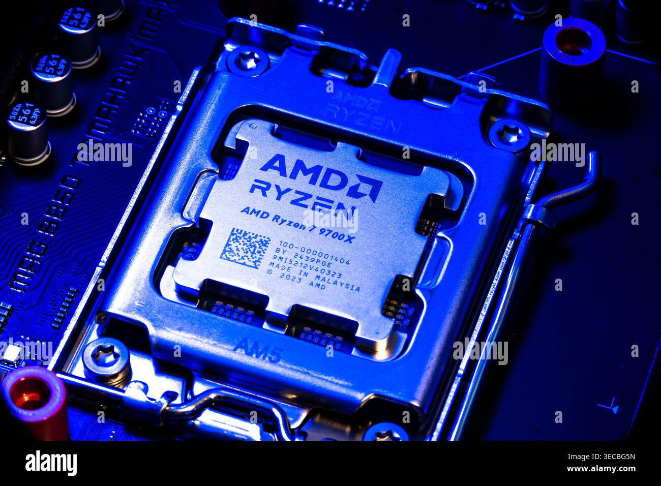 AMD Ryzen 7900x Processor Chip Installed In Cpu Socket On Computer Motherboard Stock Photo